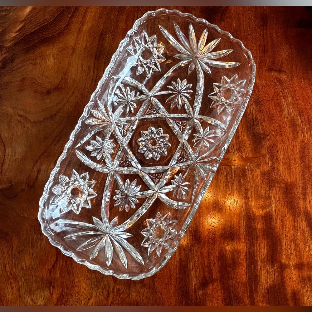 Glass serving dish with cut glass designs